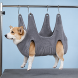 Gray dog grooming hammock supporting a dog comfortably