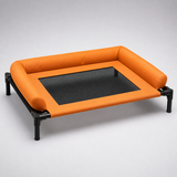 Orange elevated dog camping cot with breathable mesh